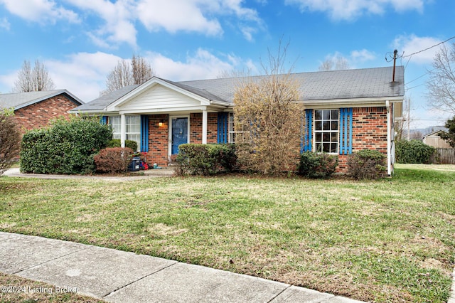 single story home featuring a front yard