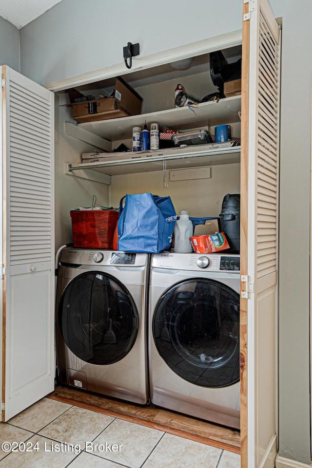 laundry room with light tile patterned floors and separate washer and dryer