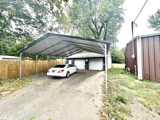 view of vehicle parking featuring a carport and a garage