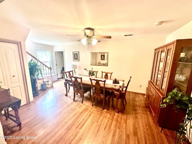 dining room featuring ceiling fan and light wood-type flooring