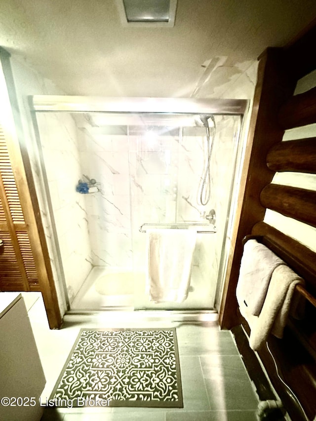 bathroom with an enclosed shower