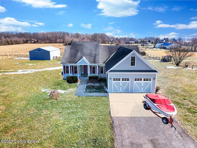 view of front of house with a garage, covered porch, and a front lawn