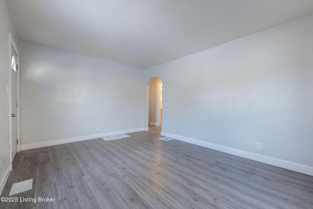 unfurnished room with hardwood / wood-style floors