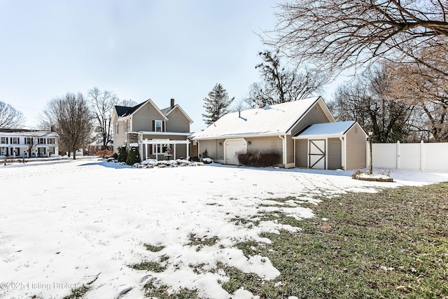 view of snow covered house