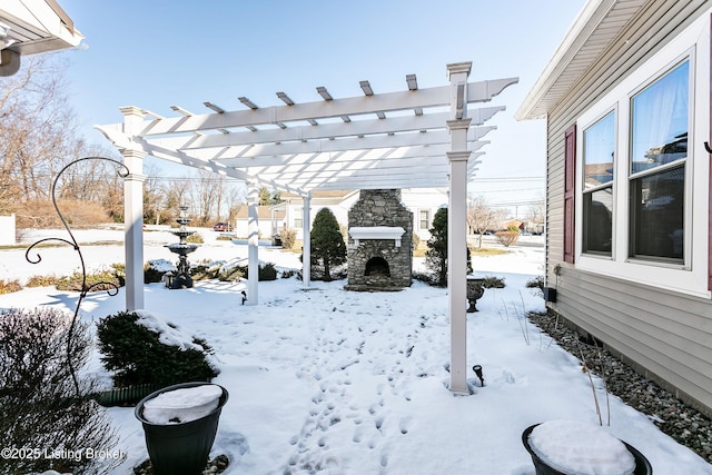 yard covered in snow with a pergola