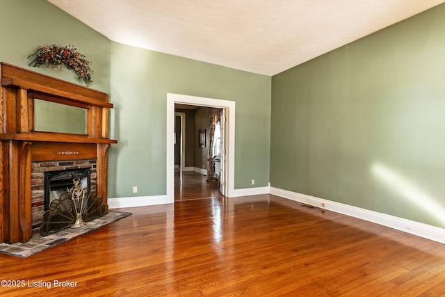 unfurnished living room featuring hardwood / wood-style floors