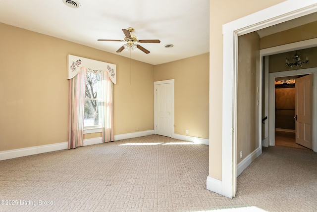 empty room with ceiling fan and carpet