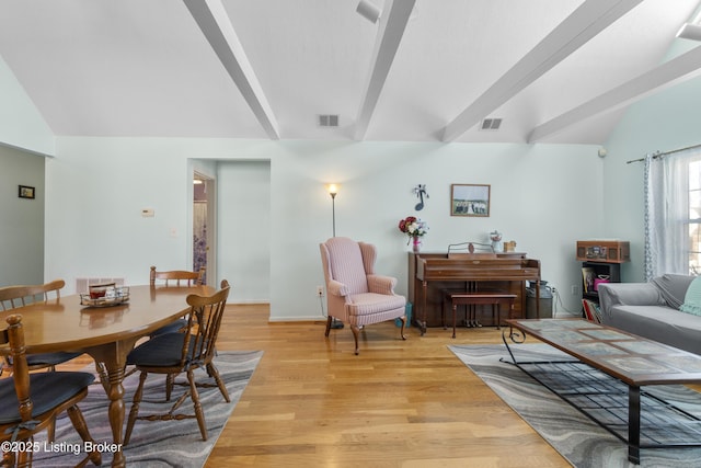 living room with lofted ceiling and light hardwood / wood-style flooring