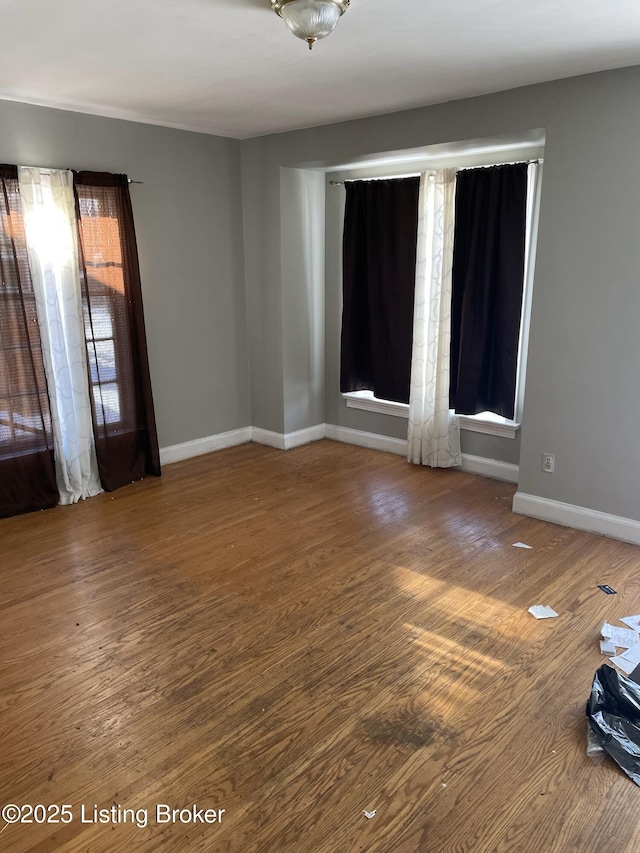 spare room featuring hardwood / wood-style flooring