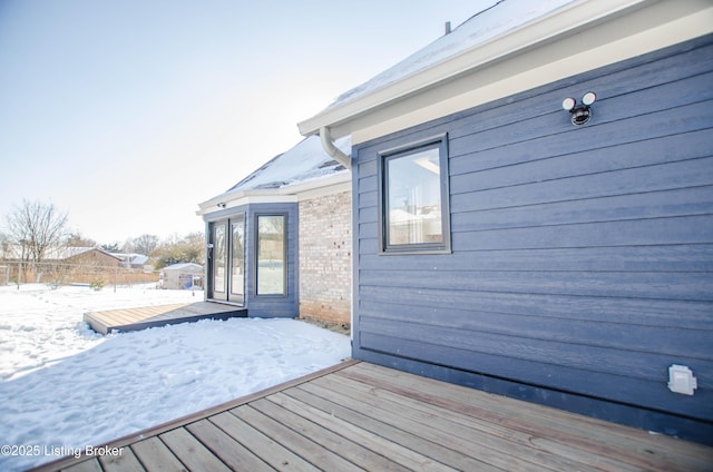 view of snow covered deck