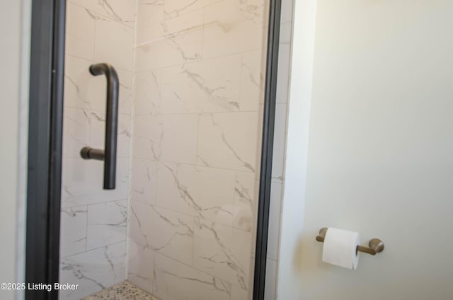 bathroom with a shower with shower door