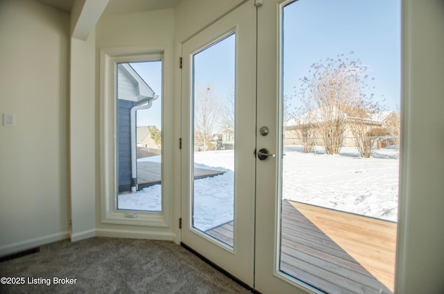 doorway with french doors and carpet