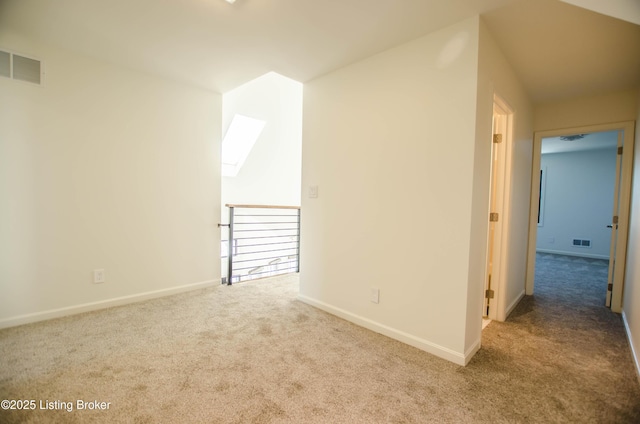 additional living space featuring light colored carpet