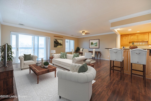 living room featuring dark hardwood / wood-style flooring and crown molding