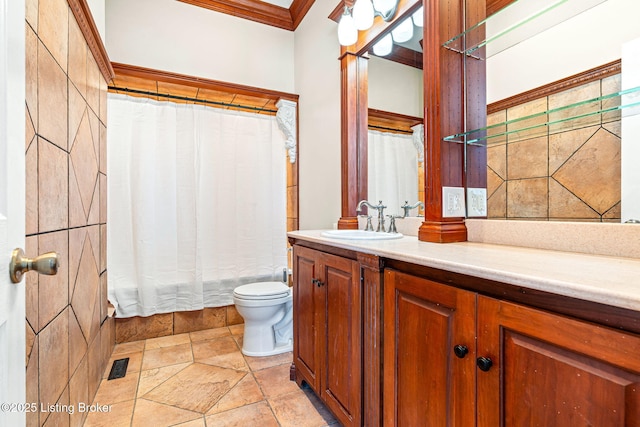 bathroom featuring toilet, vanity, crown molding, and curtained shower