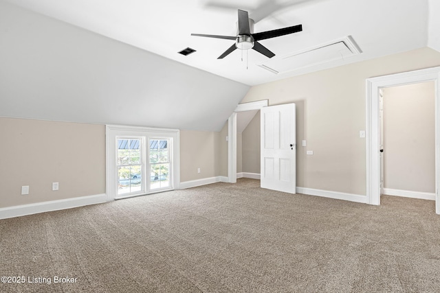 additional living space featuring carpet floors, ceiling fan, and lofted ceiling