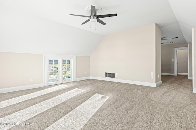 additional living space with ceiling fan, carpet, and vaulted ceiling