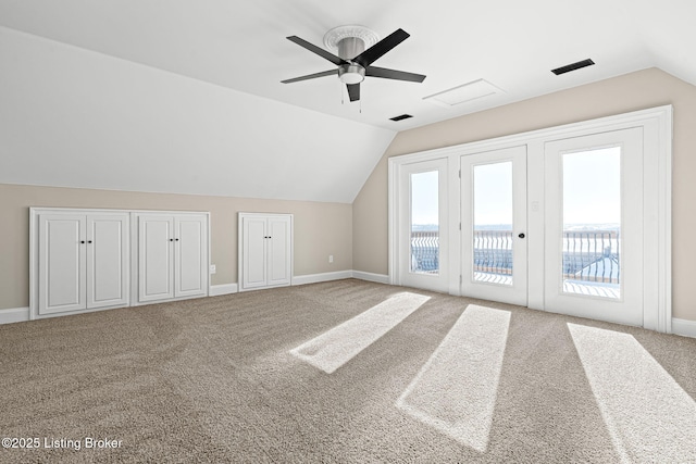 bonus room with ceiling fan, vaulted ceiling, french doors, and carpet flooring