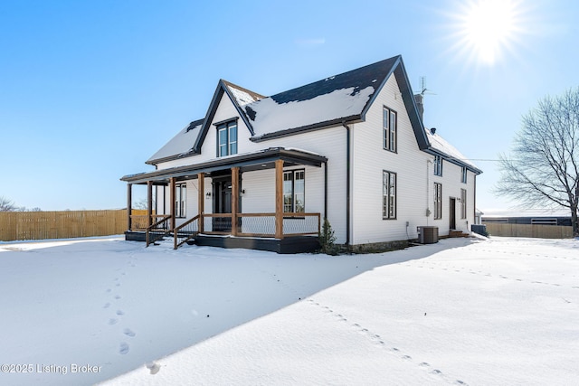 view of front of property with cooling unit and covered porch