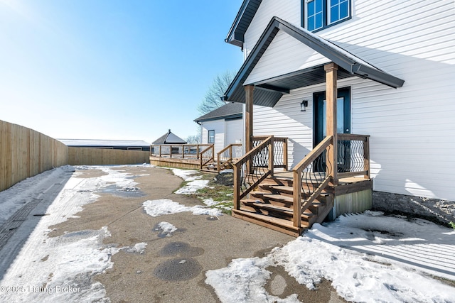 view of snow covered property entrance