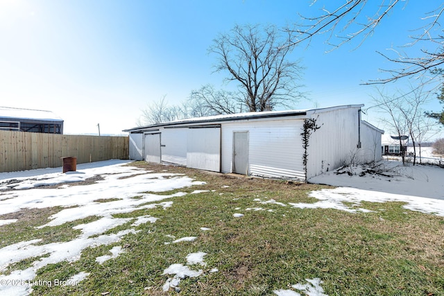 view of snow covered garage