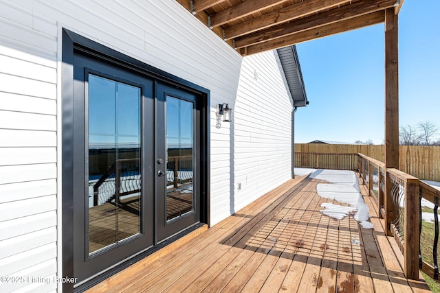 wooden deck featuring french doors