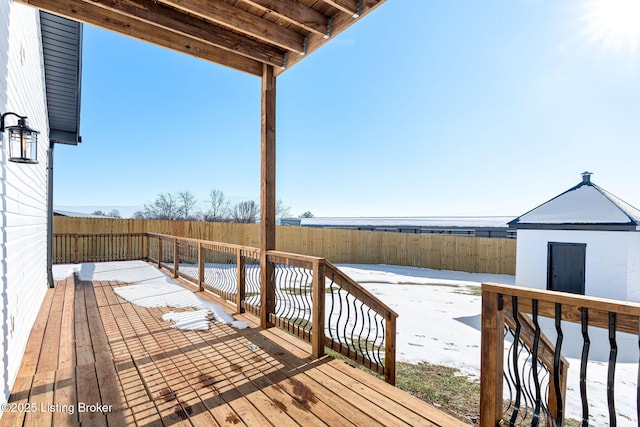 wooden terrace with a storage shed