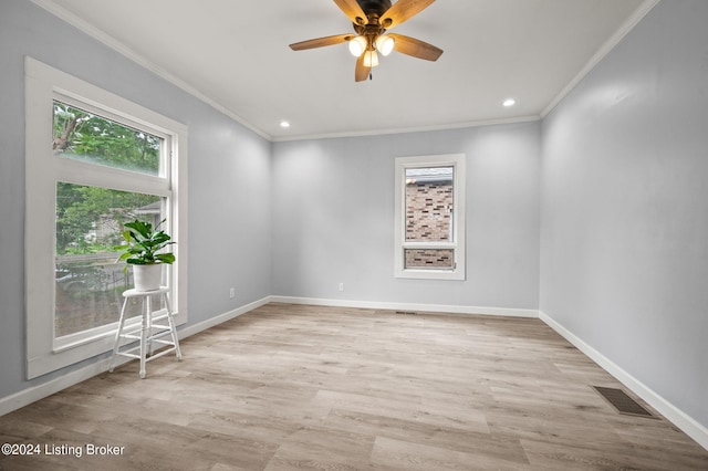 spare room with light wood-type flooring, ceiling fan, and ornamental molding