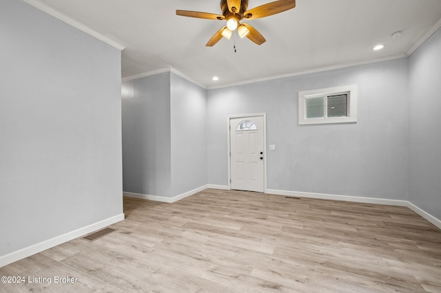 entrance foyer featuring ceiling fan, ornamental molding, and light hardwood / wood-style flooring