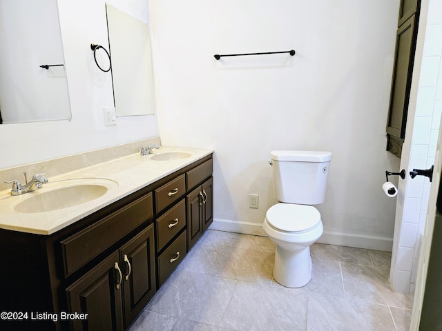 bathroom with toilet and vanity