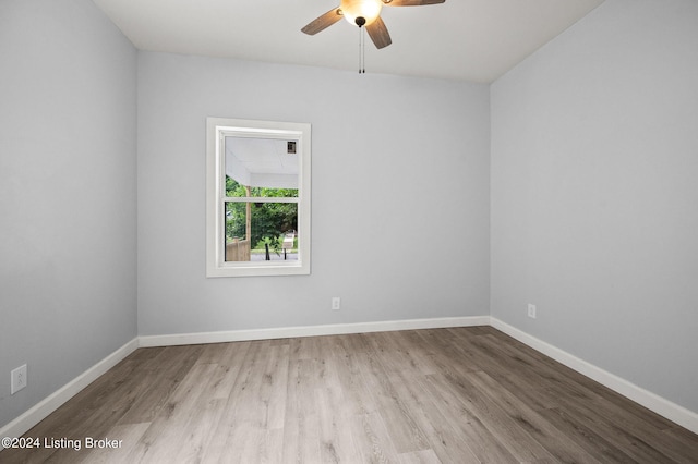 unfurnished room with ceiling fan and light hardwood / wood-style floors