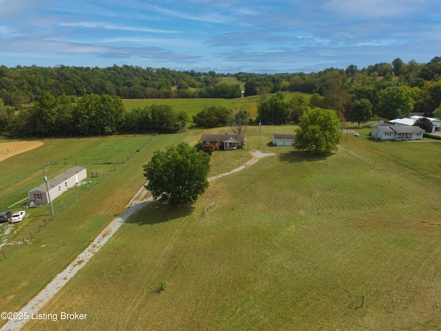 birds eye view of property with a rural view