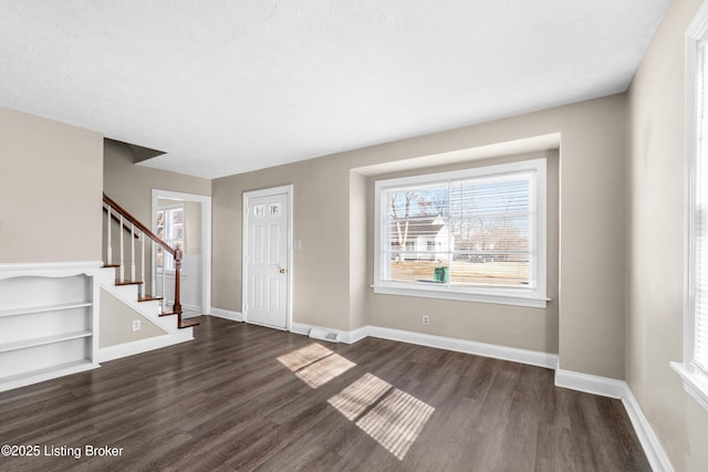 foyer entrance featuring dark hardwood / wood-style flooring