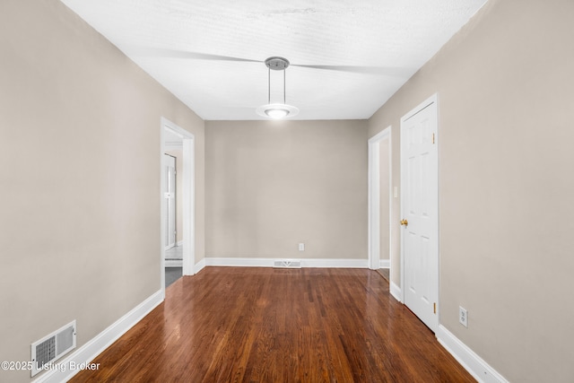 unfurnished dining area with dark hardwood / wood-style floors