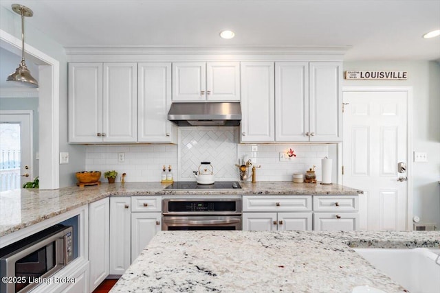 kitchen with light stone countertops, appliances with stainless steel finishes, white cabinetry, tasteful backsplash, and hanging light fixtures