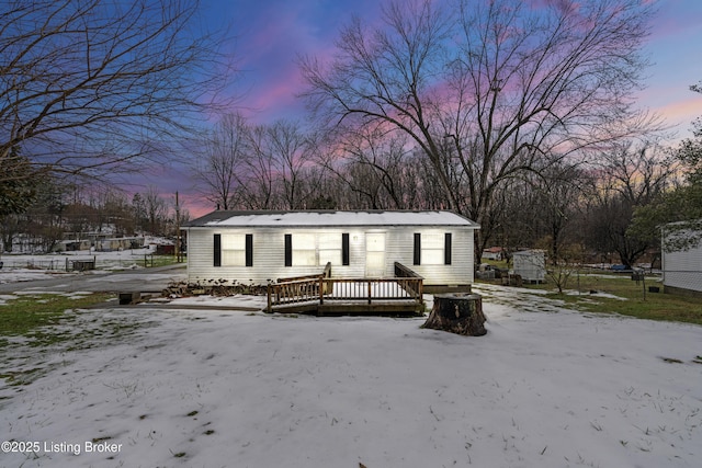 view of front of property featuring a wooden deck