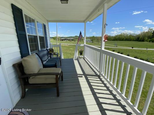 wooden deck with a yard and a porch