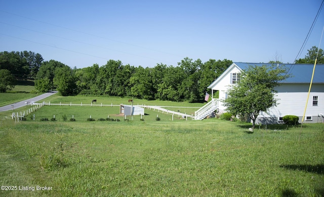 view of yard with a rural view