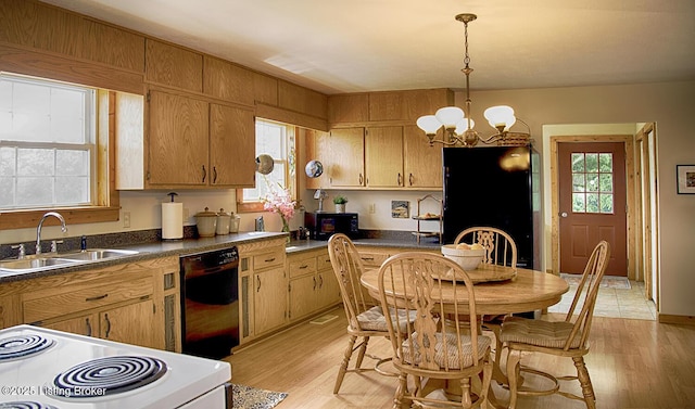 kitchen with light wood-type flooring, an inviting chandelier, sink, and black appliances