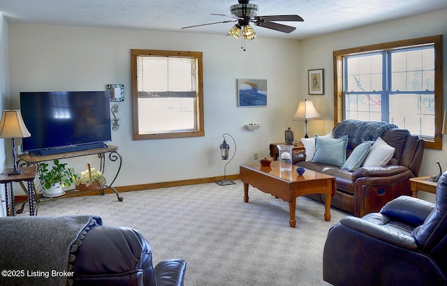 living room with ceiling fan and light colored carpet