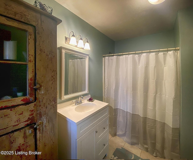 bathroom featuring tile patterned floors and vanity