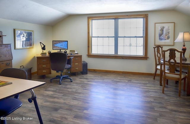 home office featuring vaulted ceiling, dark hardwood / wood-style flooring, and a textured ceiling