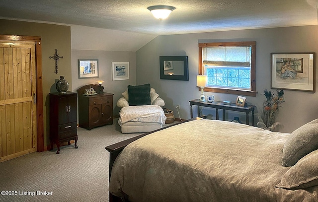 bedroom with carpet floors, a textured ceiling, and lofted ceiling