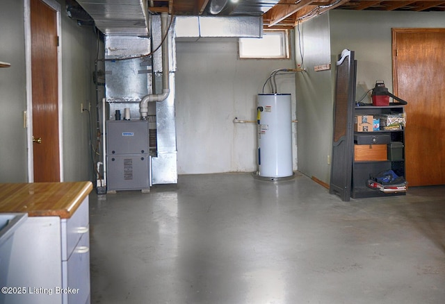 utility room featuring water heater and heating unit