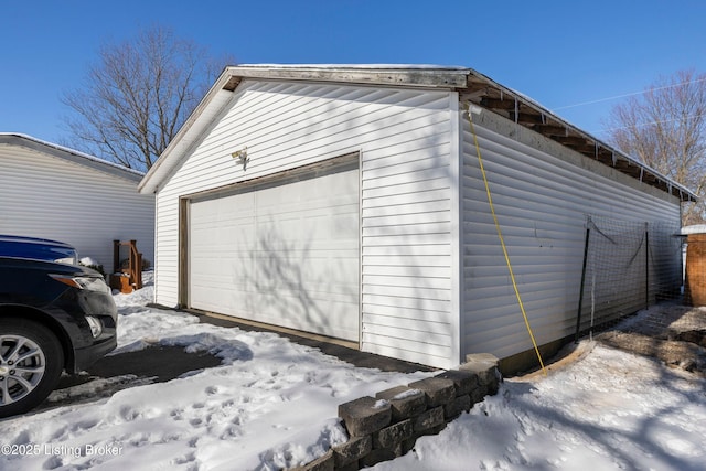 view of snow covered garage