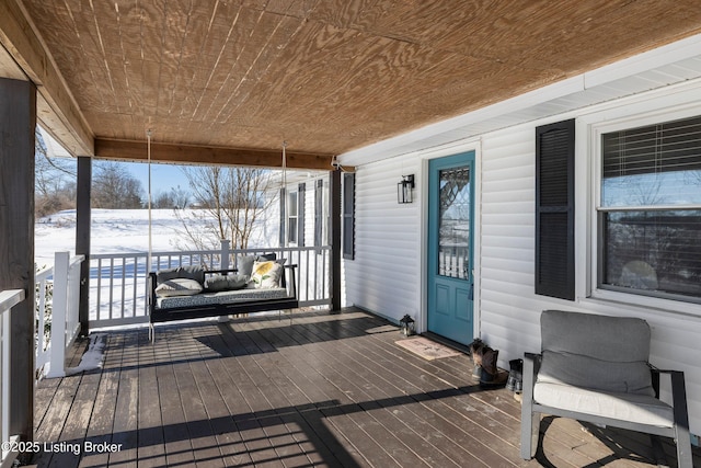 view of snow covered deck