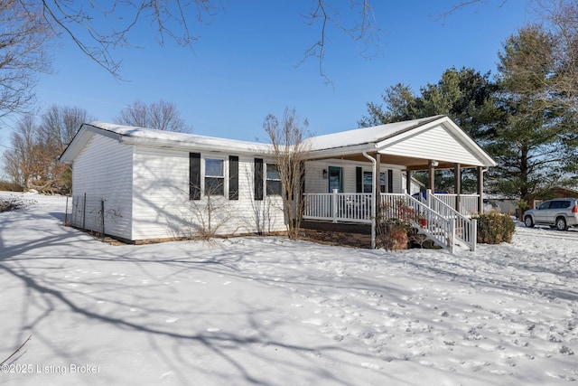 single story home featuring covered porch