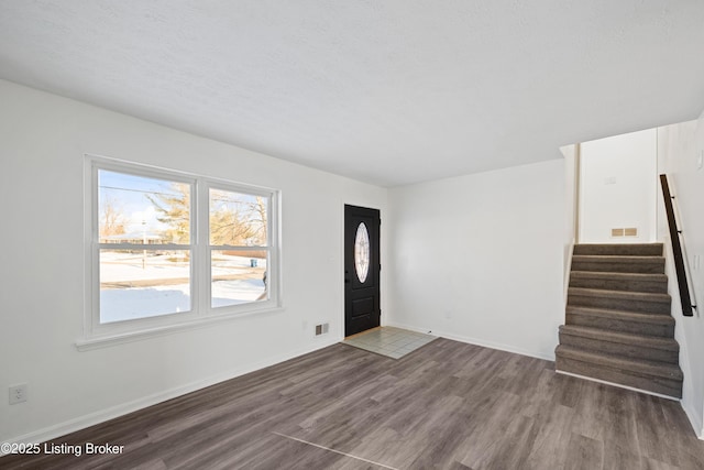 foyer with dark wood-type flooring