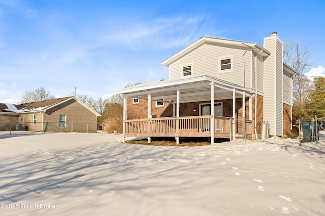 back of house with central AC and a porch