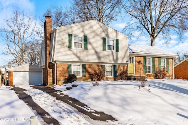 view of front of house featuring a garage and an outdoor structure